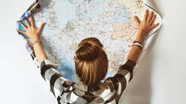 A woman looking at a map